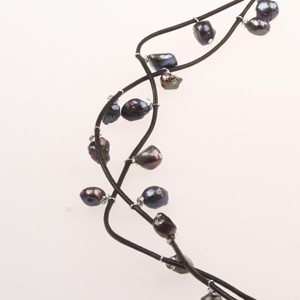 A beautiful Necklace with Freshwater Pearls on a Leather Cord