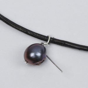 A beautiful Necklace with Freshwater Pearls on a Leather Cord