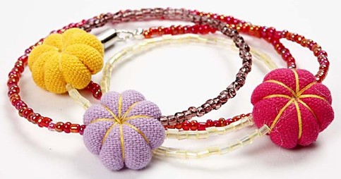 A Bracelet with Rocaille beads and Mini Fabric Pumpkins