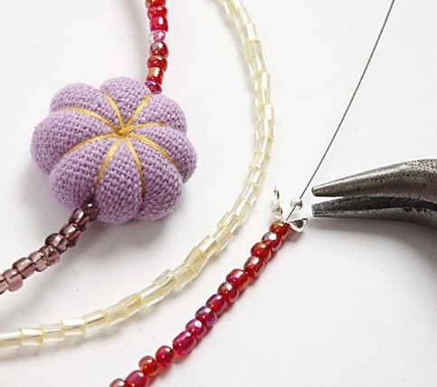 A Bracelet with Rocaille beads and Mini Fabric Pumpkins