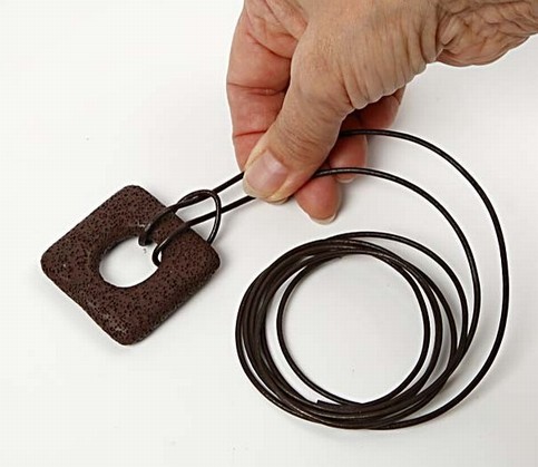 A Design Cord Necklace with a lava ring