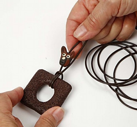 A Design Cord Necklace with a lava ring