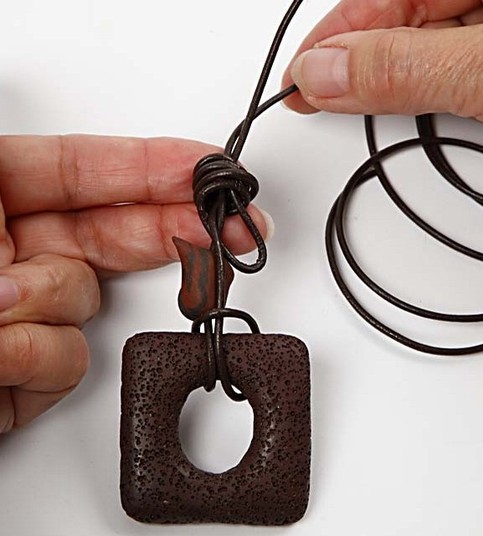 A Design Cord Necklace with a lava ring