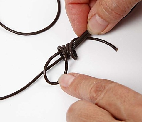 A Design Cord Necklace with a lava ring