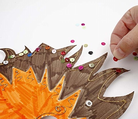 Cardboard Masks decorated with Marker Pens and Sequins