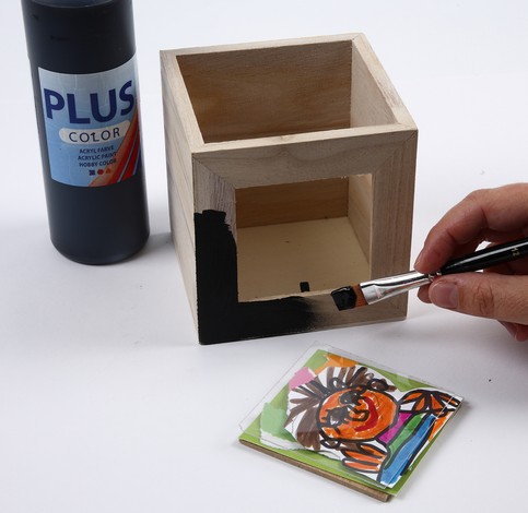 A Small Wooden Storage Box, decorated with Collage