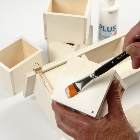 A Wooden Coat Rack with Masking Tape