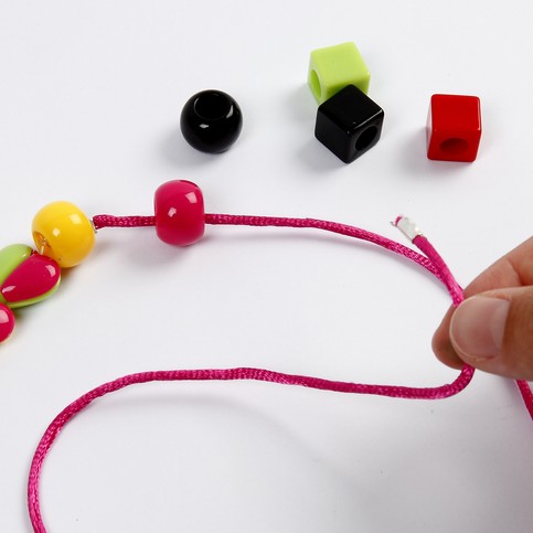 A Necklace with a Shrink Plastic Pendant and Hearts