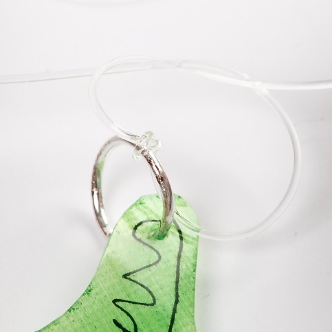 A Necklace with a Shrink Plastic Pendant and Hearts