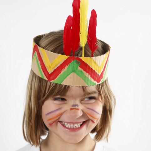 A Head Dress made from Painted Corrugated Board, decorated with Feathers