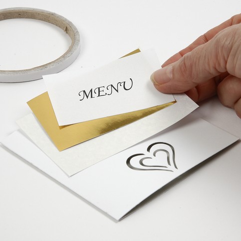 A Party Invitation and Card with Punched-Out Decorations