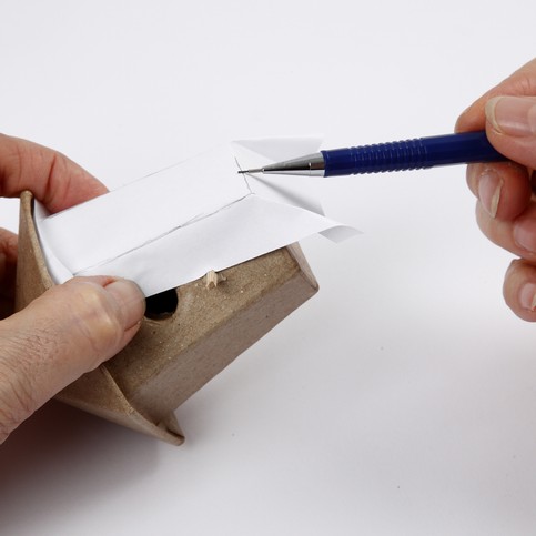 A small Papier-M ch  House, covered with Handmade Paper