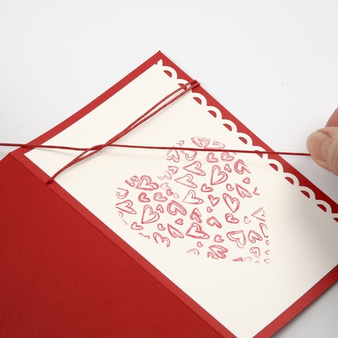 A Tablecloth and a Greeting Card with printed Hearts