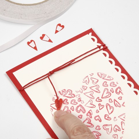 A Tablecloth and a Greeting Card with printed Hearts