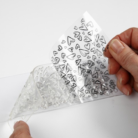 A Tablecloth and a Greeting Card with printed Hearts