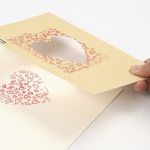 A Tablecloth and a Greeting Card with printed Hearts