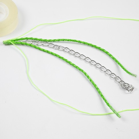 A Neon-Coloured Plaited Cord with sewn-on Piece of Jewellery Chain