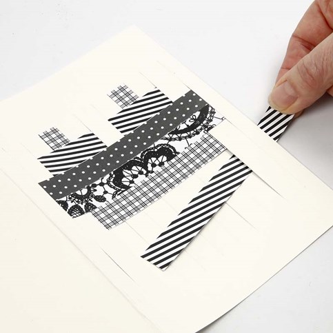 A Folded Greeting Card with a Woven Design made from Vivi Gade Design Paper