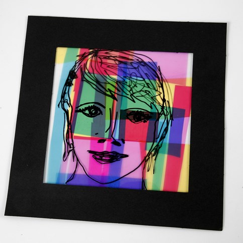 A framed Portrait on a Collage of Coloured Cellophane