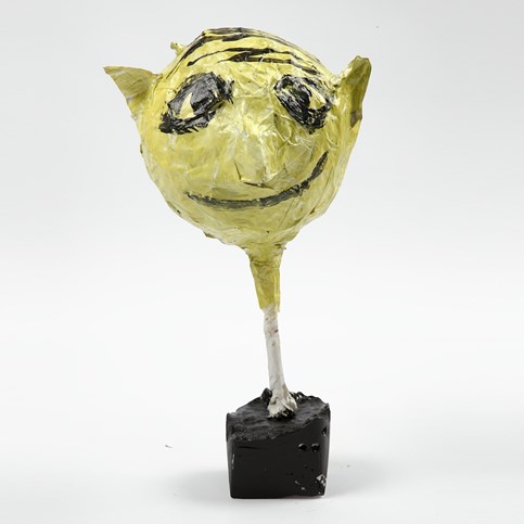 A Head with facial Features made from Papier-M ch  on a Balloon