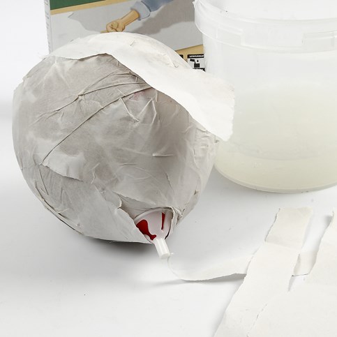 A Head with facial Features made from Papier-M ch  on a Balloon