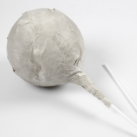 A Head with facial Features made from Papier-M ch  on a Balloon