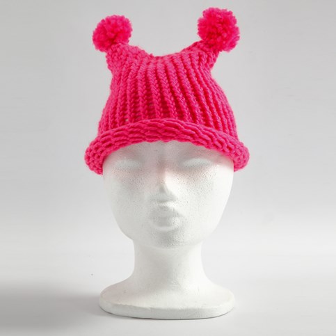 A Hat with two Pom Poms knitted on a Knitting Loom