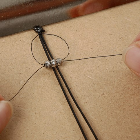 A Braided Bracelet made from Leather Cord and Faceted Beads