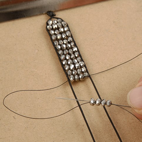 A Braided Bracelet made from Leather Cord and Faceted Beads