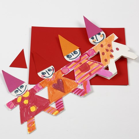 A Christmas Border of Dancing Children made from Punched-Out Card