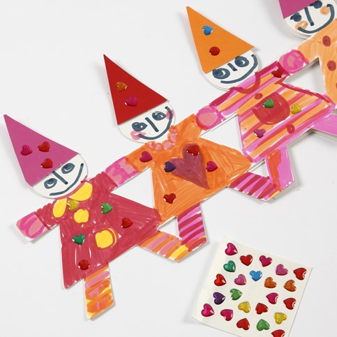 A Christmas Border of Dancing Children made from Punched-Out Card