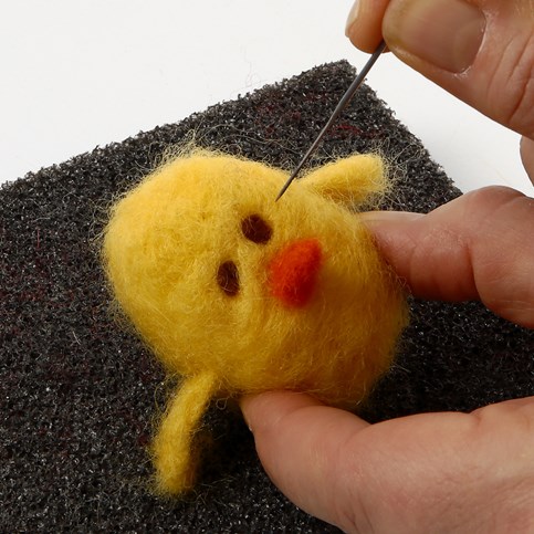 A Needle Felted Chick in a Two-Piece Plastic Egg