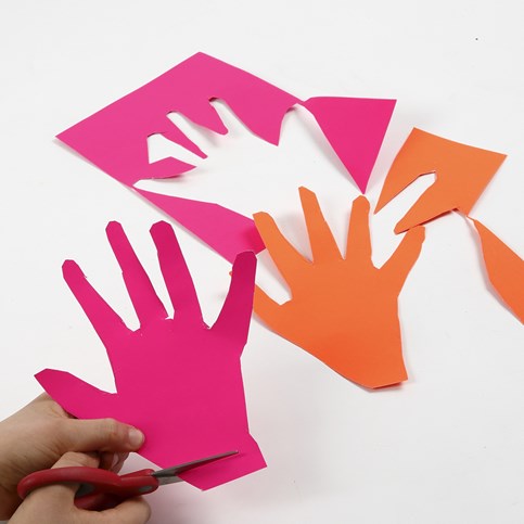 A Neon Coloured Card Flower made from Hands