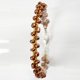 A Plaited Bracelet made from Leather Cords and Rocaille Seed Beads