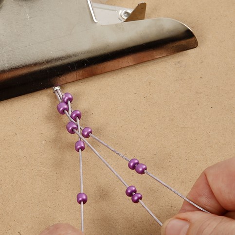 A Plaited Bracelet made from Leather Cords and Rocaille Seed Beads