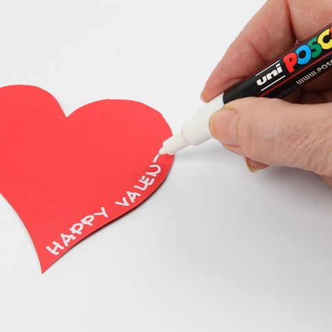 A Valentine Card with Design Paper and a Heart made from red Card