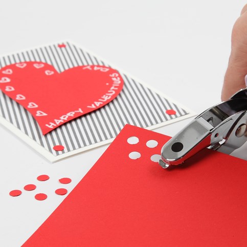 A Valentine Card with Design Paper and a Heart made from red Card