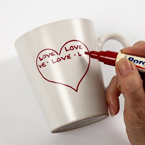 A white porcelain Mug with red Love Motifs