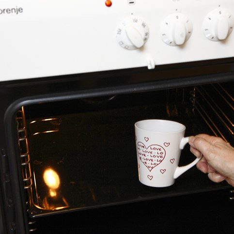 A white porcelain Mug with red Love Motifs