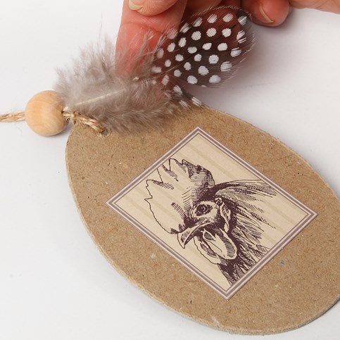 Flat Papier-M ch  Eggs with a Glued-On Motif and Guinea Fowl Feathers