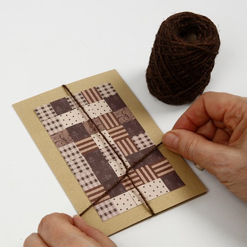 A Christmas Card with a Patchwork made from woven Paper Strips