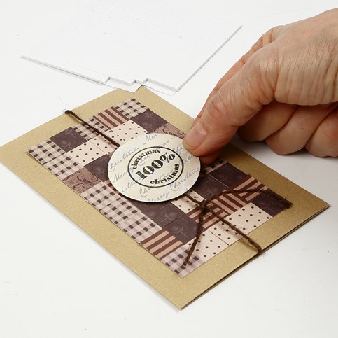 A Christmas Card with a Patchwork made from woven Paper Strips