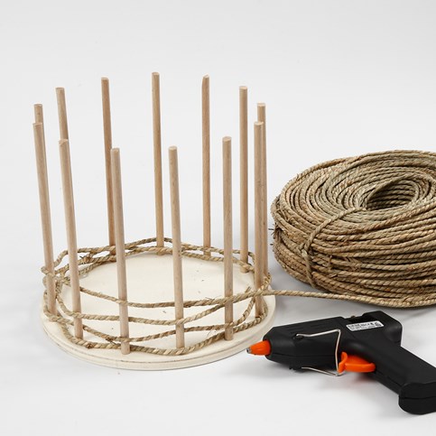 Basket Weaving around a wooden Base and Flower Sticks