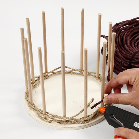 Basket Weaving around a wooden Base and Flower Sticks