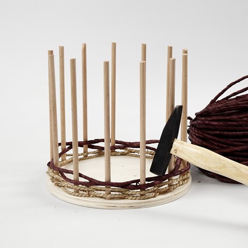 Basket Weaving around a wooden Base and Flower Sticks