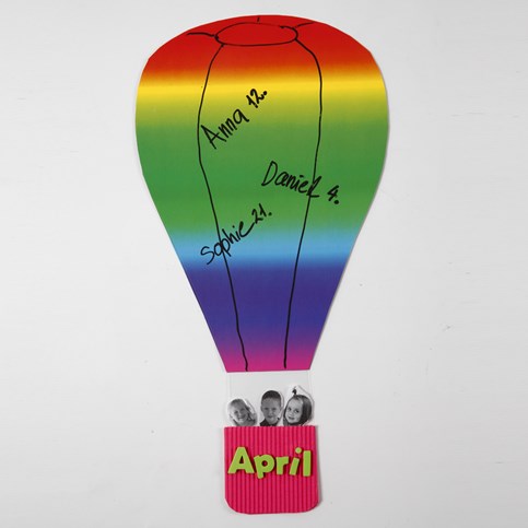 A Hot Air Balloon made from Rainbow Card with a Corrugated Board Basket