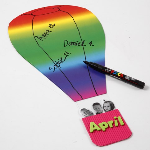 A Hot Air Balloon made from Rainbow Card with a Corrugated Board Basket