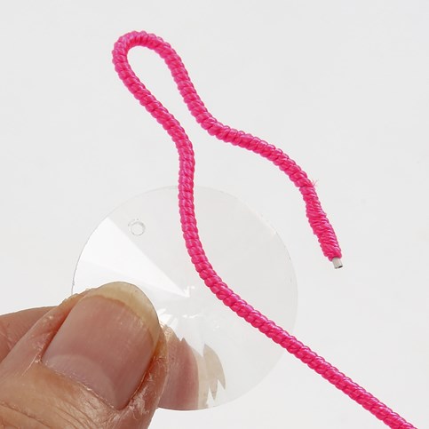 A Necklace with a Prism in a Net made from a Nylon covered Aluminium Bar