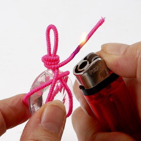 A Necklace with a Prism in a Net made from a Nylon covered Aluminium Bar