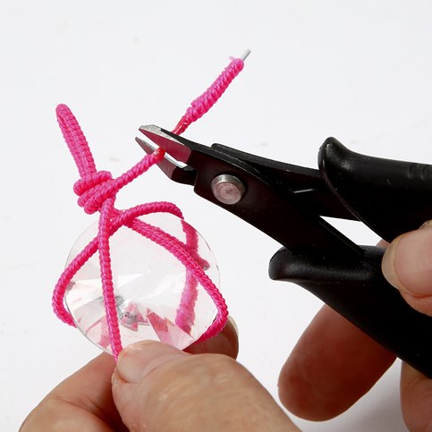 A Necklace with a Prism in a Net made from a Nylon covered Aluminium Bar